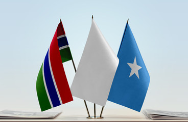 Flags of The Gambia and Somalia with a white flag in the middle