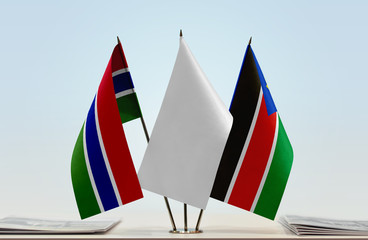 Flags of The Gambia and South Sudan with a white flag in the middle