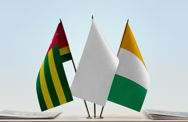Flags of Togo and Ivory Coast with a white flag in the middle