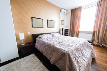 close up view of arranged stylish bedroom with closet and bed