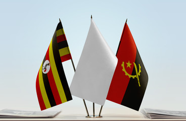 Flags of Uganda and Angola with a white flag in the middle