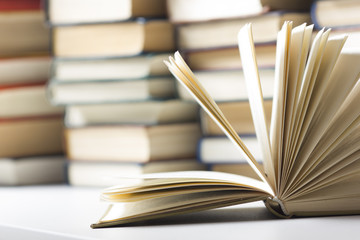 Open book, hardback books on wooden table. Back to school. Copy space