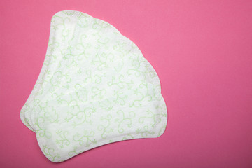 Set of sanitary pads on pink background.
