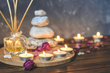 Spa composition-stones, candles, aromatherapy, dry flowers.
