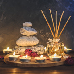 Spa composition-stones, candles, aromatherapy, dry flowers.