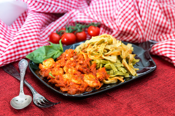 spaghetti with pesto sauce and Shrimp on a the table