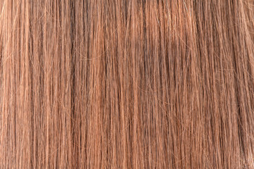 Natural colored shiny healthy human hair. Haircare technology, style and beauty concept. Abstract texture background. Detailed closeup