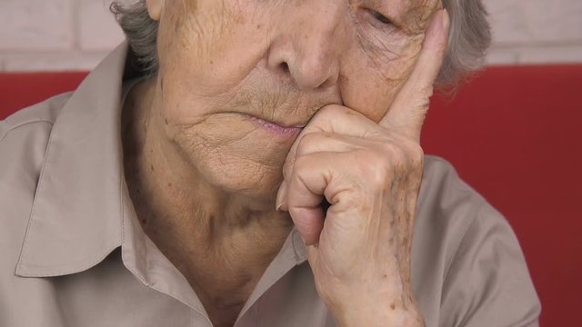 Sad elderly woman. Portrait of a sad old woman.