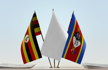 Flags of Uganda and Swaziland with a white flag in the middle