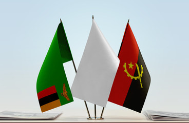 Flags of Zambia and Angola with a white flag in the middle