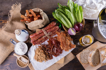 Chinese sausage and Pounded pork jerky for cook on a wooden background