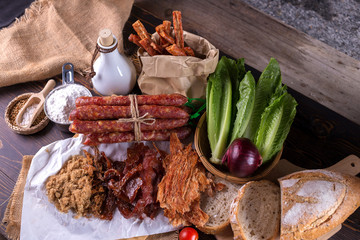 Chinese sausage and Pounded pork jerky for cook on a wooden background