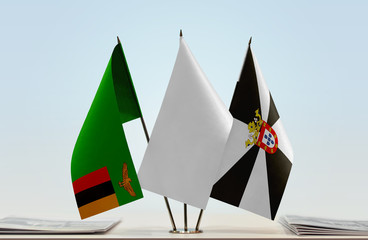 Flags of Zambia and Ceuta with a white flag in the middle
