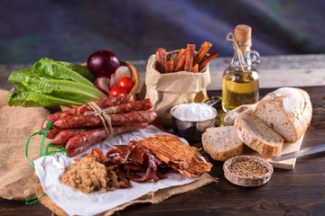 Chinese sausage and Pounded pork jerky for cook on a wooden background