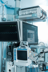 medical equipment with screens in surgery room