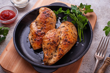 Grilled chicken breast or fillet on iron pan