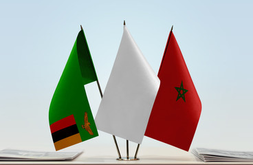 Flags of Zambia and Morocco with a white flag in the middle