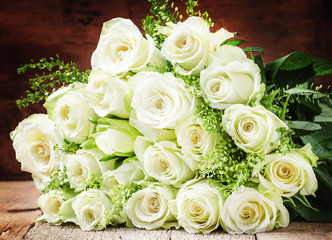 Bouquet of white roses for women's day, gray background, selective focus