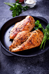 Grilled chicken breast or fillet on iron pan
