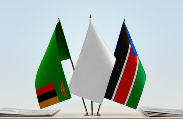 Flags of Zambia and South Sudan with a white flag in the middle