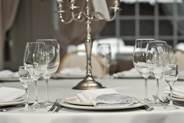 Glass dishes on a table on a white tablecloth