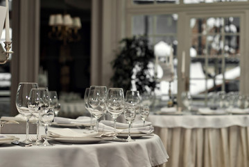 Glass dishes on a table on a white tablecloth