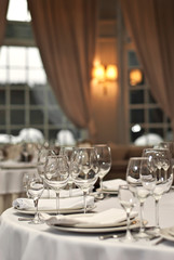 Glass dishes on a table on a white tablecloth
