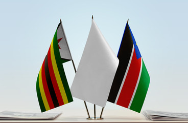 Flags of Zimbabwe and South Sudan with a white flag in the middle