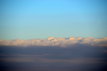 Clouds illuminated by the Sun in backlight.