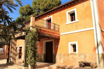 Typical and colorful house in a palm orchard in Elche, Spain