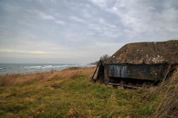 Fototapeta na wymiar Old war bunker by the coast