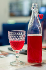 red for the drink in the bottle and the glass