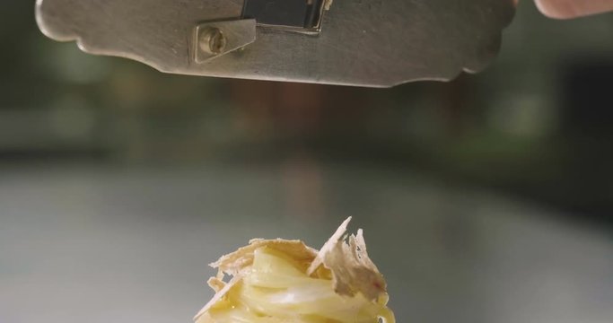 Egg pasta dish, typical Italian, with fine white truffle grated on top. Concept of: gourmet cuisine, truffles, Italian pasta, fine dishes.