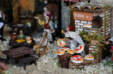 Curious nativity scene (italian traditional presepe) with a pizza maker figurine