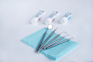 Group of tools and accessories for dental care and treatment. Isolated on white background.