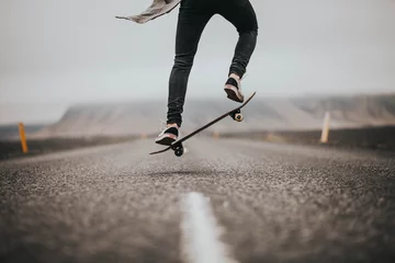 Foto op Plexiglas Man young skateboarder legs skateboarding  © yuliiakas