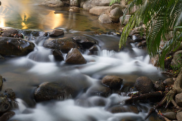 Fototapeta na wymiar Waterfall with green environment