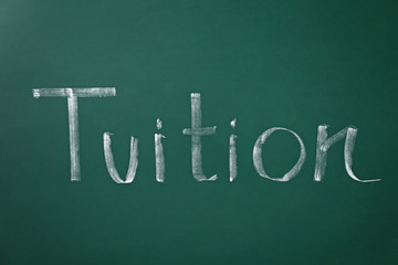 Obraz premium Word TUITION written on chalkboard