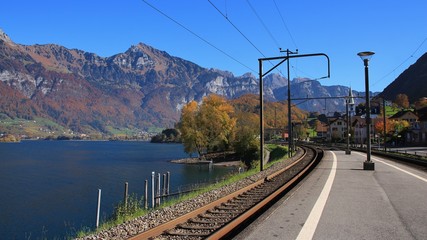 View from the train station in Mols, St Gallen canton, Switzerland. Autumn day at lake Walensee. Mountain of the Churfirsten range.