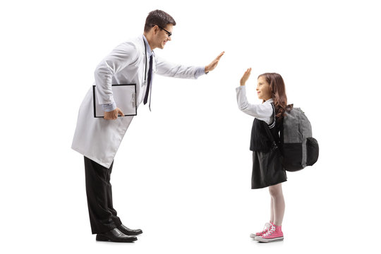 Doctor high-fiving with a little schoolgirl