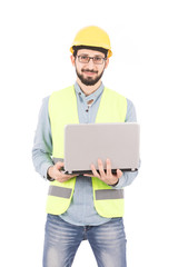 young engineer holds a laptop