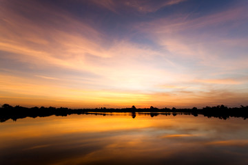 colorful dramatic sky with cloud at sunset.