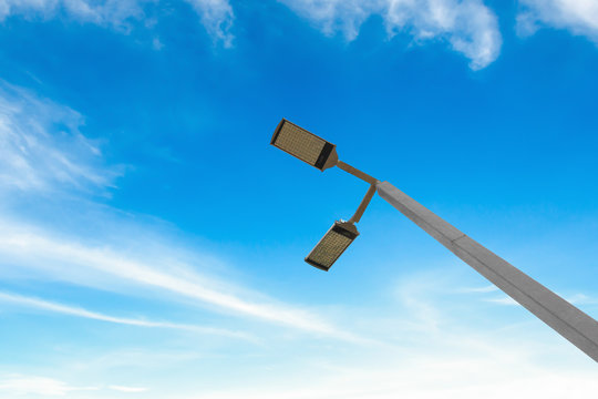 led street lamps with solar energy power on blue sky background