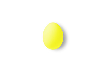 One yellow egg on a yellow background.  Minimalism style