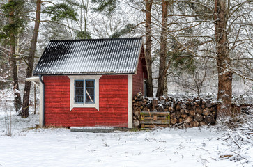 Typical Swedish cabin in winter scenery