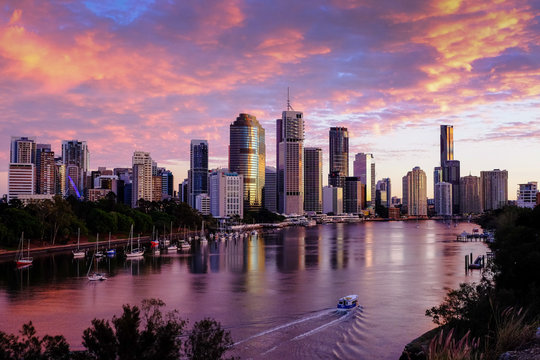 View of Brisbane city and Brisbane River early in the morning with pink clouds