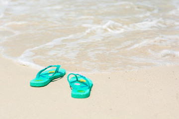 Fototapeta na wymiar Summer shoes at beach