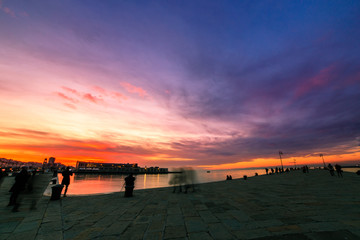 Fototapeta na wymiar Colorful sunset in front of the city of Trieste