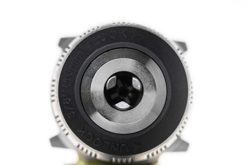 Macro shot of the keyless drill chuck on white background