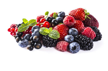 Mix berries isolated on a white. Ripe blueberries, blackberries, raspberries, currants and strawberries. Berries and fruits with copy space for text. Various fresh summer berries on white